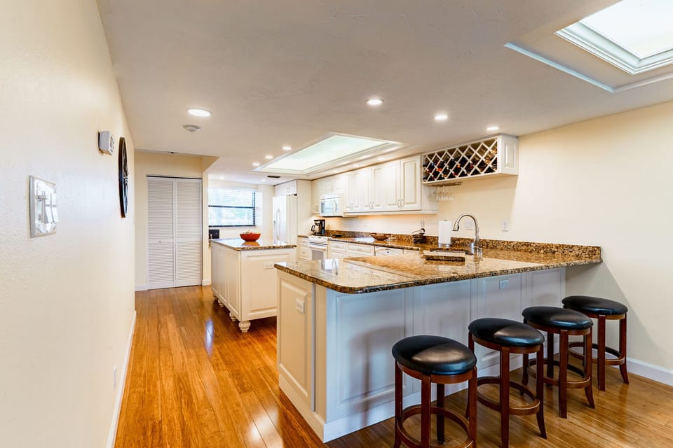 The wine rack next to the cabinets allows for you to enjoy your wine and keep it safe