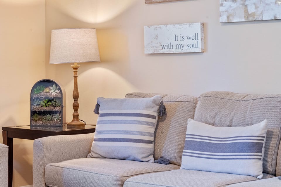 Living Room. Comfortable furniture and decor, overlooking pool/spa with grill.