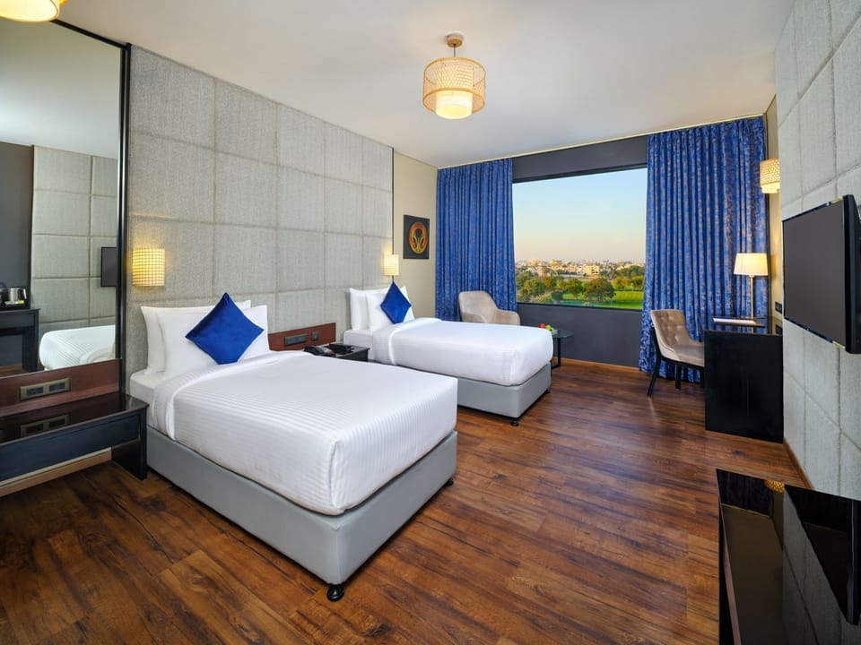 Deluxe Room, 2 Twin Beds (DELUXE TWIN) | In-room safe, laptop workspace, soundproofing, iron/ironing board