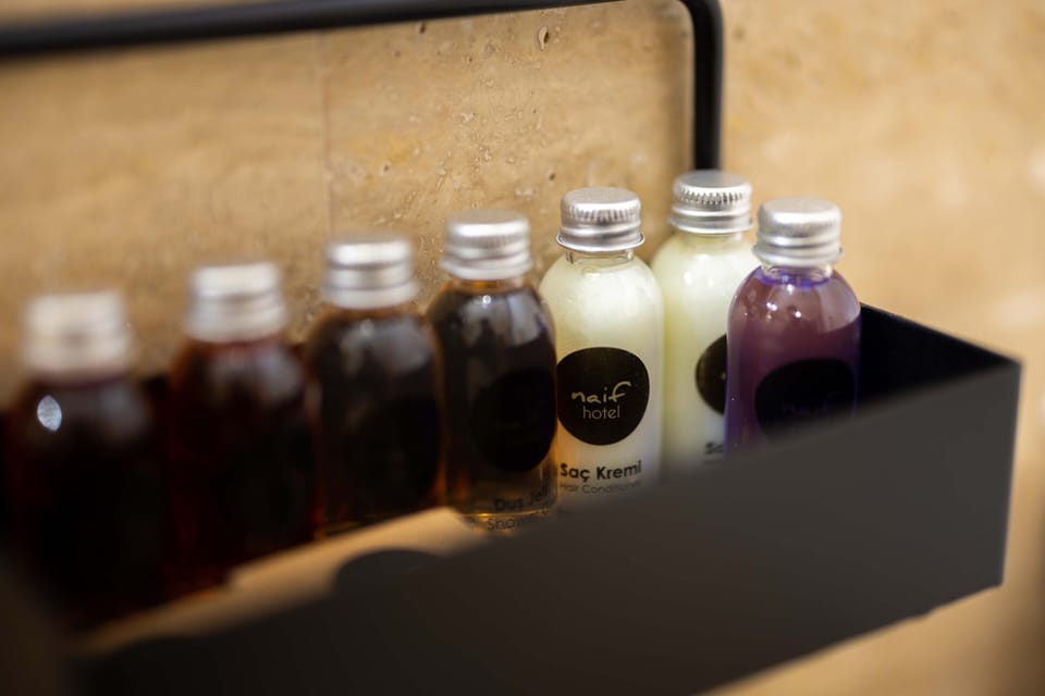 Luxury Room | Bathroom | Eco-friendly toiletries, hair dryer, slippers, towels