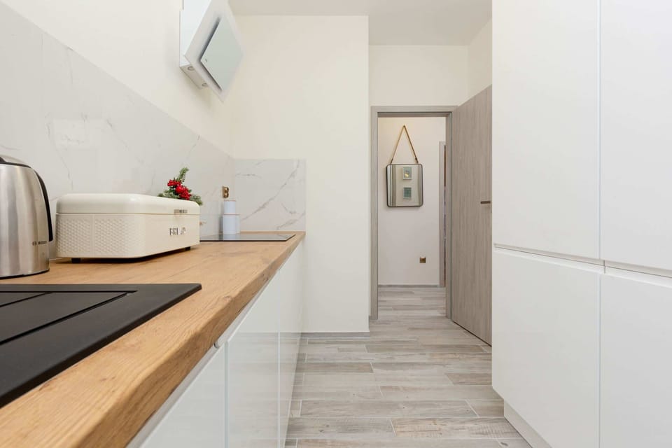 A fully equipped kitchen with ample counter space and functional appliances.
