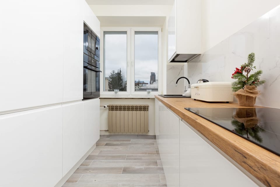 A fully equipped kitchen with ample counter space and functional appliances.
