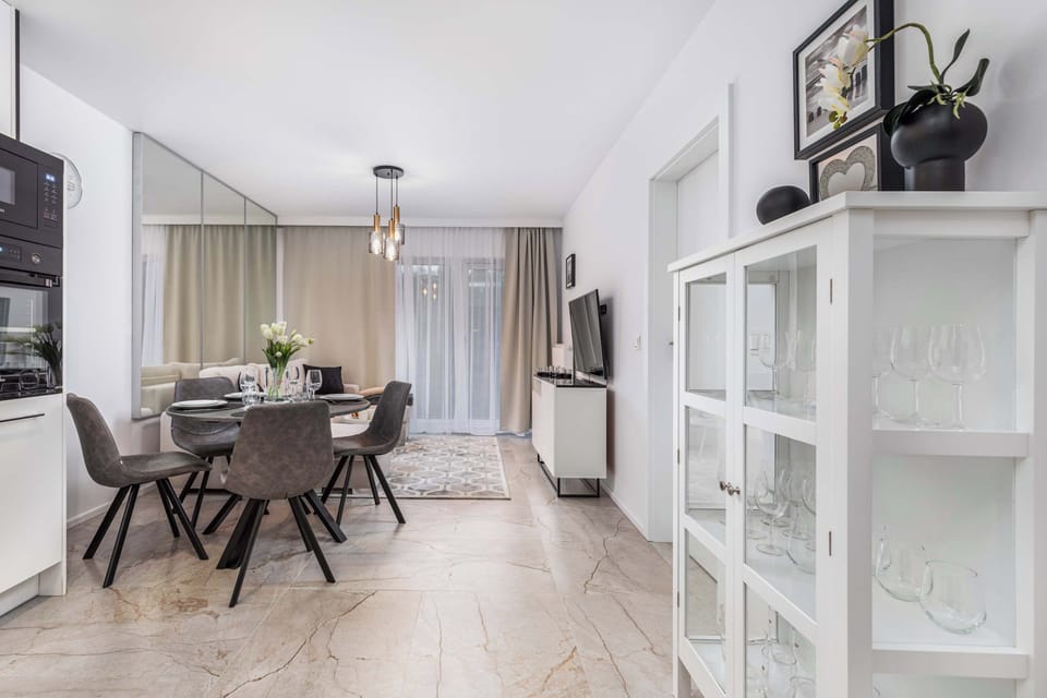 A comfortable table with four chairs provides a comfortable space for sharing meals. 