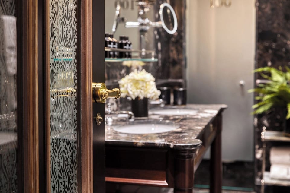 Designer toiletries, hair dryer, bathrobes, slippers