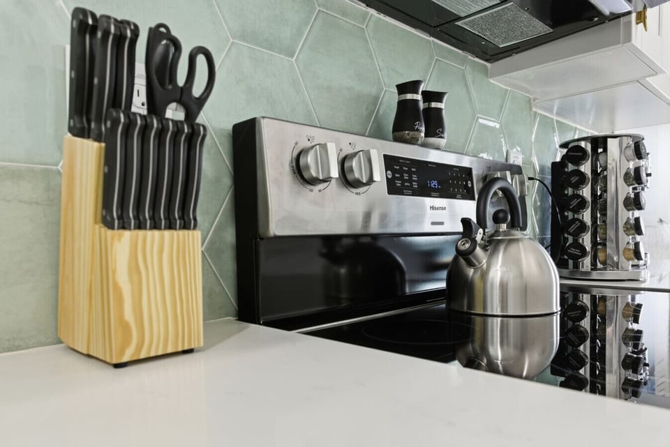 Kitchen: Modern appliances and sleek surfaces await your culinary adventures!