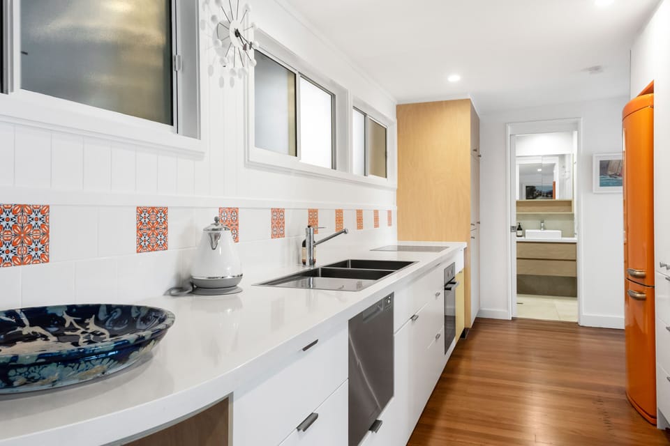 Island bench, stainless appliances and full kitchen support easy meals in Noosa.