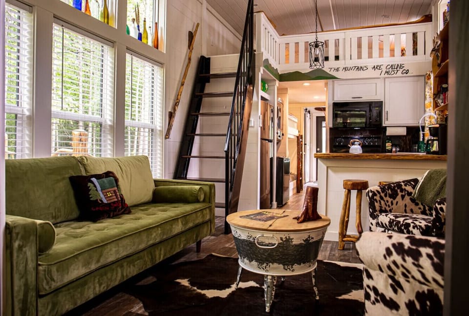 Bright and cozy living room stocked with games (monopoly, monopoly deal, Yahtzee, uno, and cards) and TV with lots of DVDs for all ages as well as free access to YouTube TV.