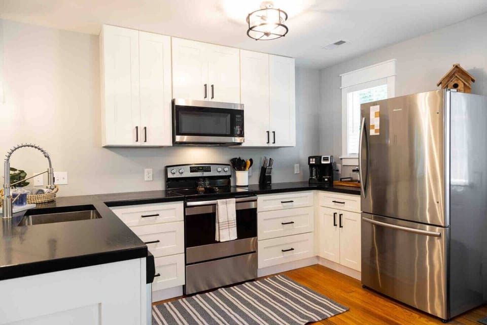 Kitchen Delight: Chic design meets culinary inspiration in this sleek, well-equipped space!