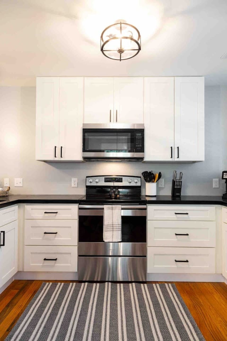 Kitchen: Ignite your culinary flair in this sleek, modern kitchen—perfect for delightful meals!