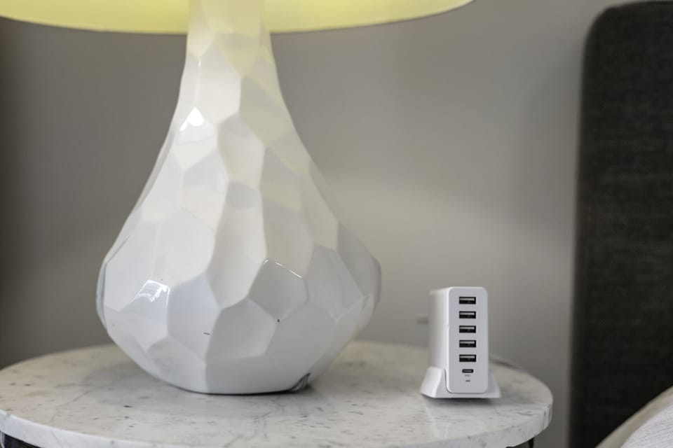 Charging station by bed.