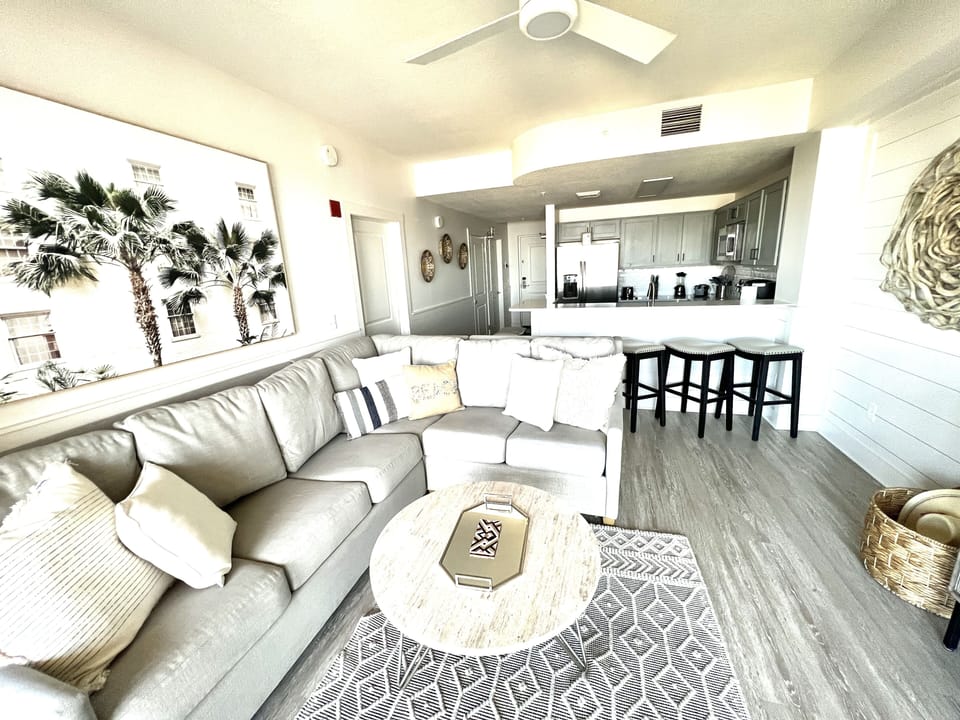 Spacious living area with durable stone coffee table. Go ahead, rest your feet!