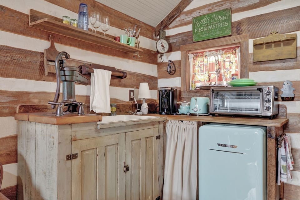 Kitchenette with toaster oven and fridge