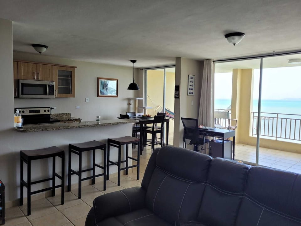 Spacious living room and full kitchen. 