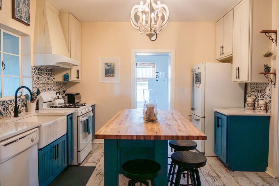 A butler`s pantry opens off of the kitchen and incudes a freezer stocked with ice.