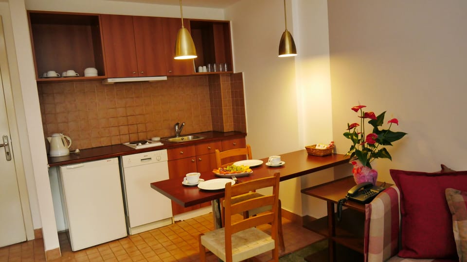 Mini-fridge, electric kettle, paper towels