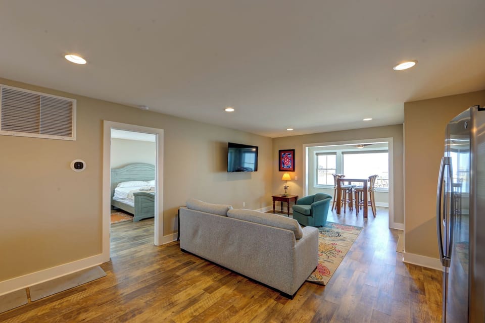Your spacious living area flows seamlessly into the dining space and bedroom, creating the perfect open-concept retreat for relaxation and connection.