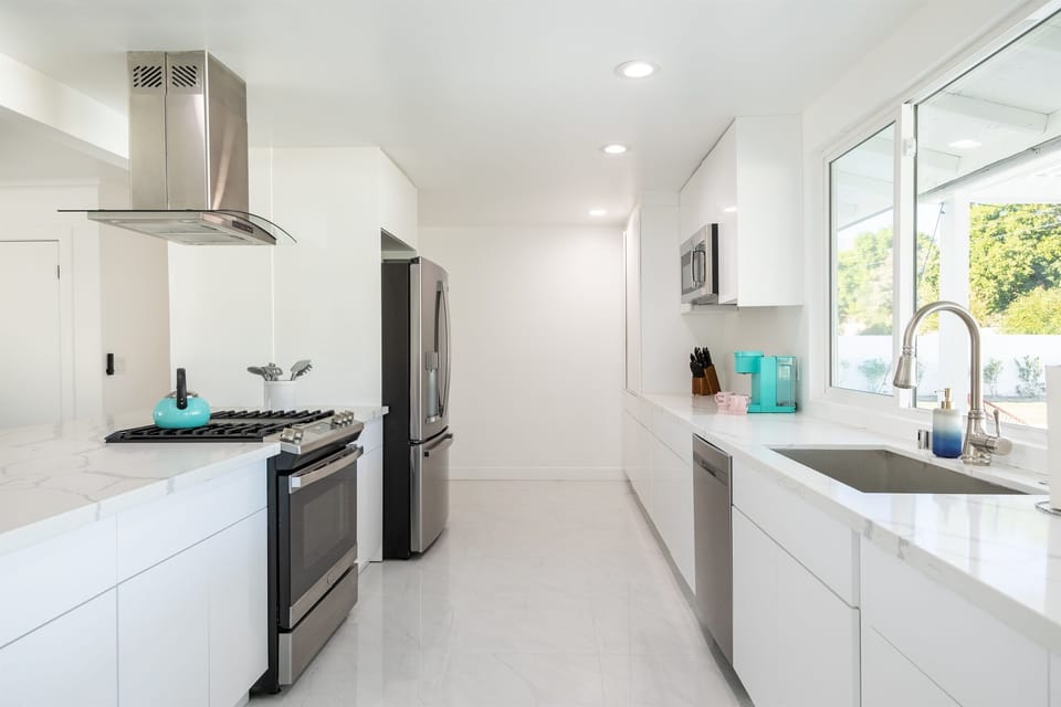 Start your day in the sunlit kitchen, where every tool, surface, and shimmer of light is made for inspired cooking and shared meals. Fully stocked gourmet kitchen with stainless steel appliances, modern finishes, and everything you need to cook at home.