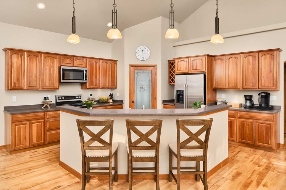 Kitchen with island, microwave, oven, fridge, coffee station, pantry (upstairs)