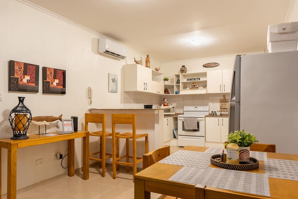 Peninsula and stools in kitchen offers more seating for larger groups