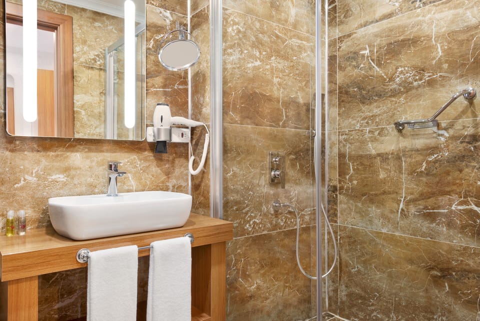 Shower, rainfall showerhead, eco-friendly toiletries, hair dryer