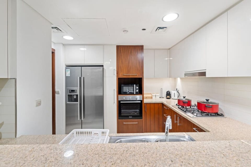 Modern Kitchen: Whip up delicious meals with top-notch appliances and stylish red cookware!