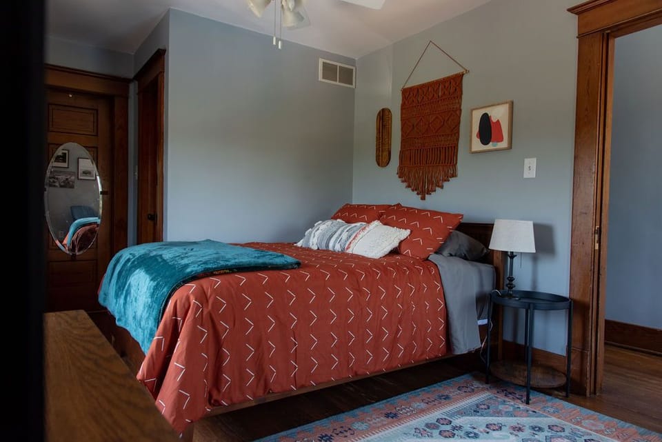 Bedroom #2: Queen bed, closet and TV.