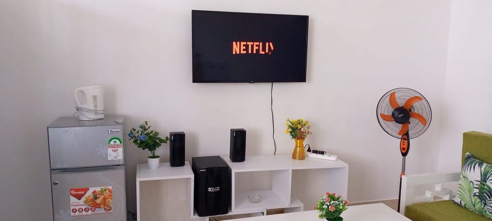 Comfort Apartment | Living area | 43-inch flat-screen TV with digital channels, TV