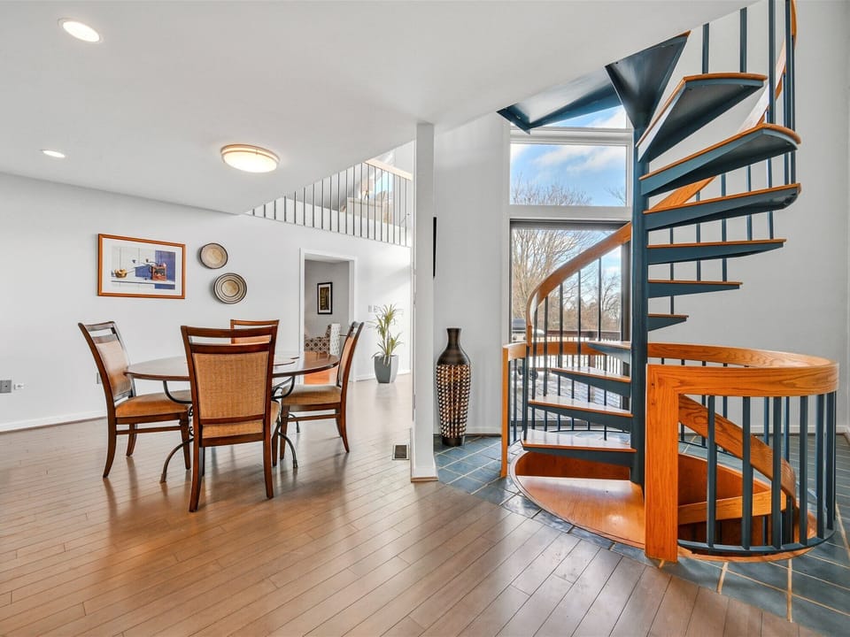 Additional dining area and spiral stairway going from basement to 2nd floor