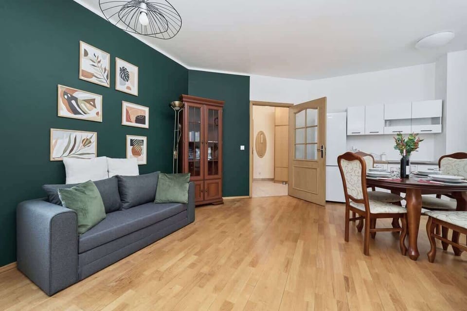A dining area within the living room, featuring a round table and four chairs for meals.
