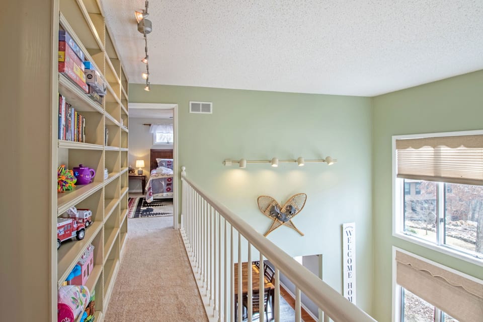 Upper level walkway overlooks the main level of the home