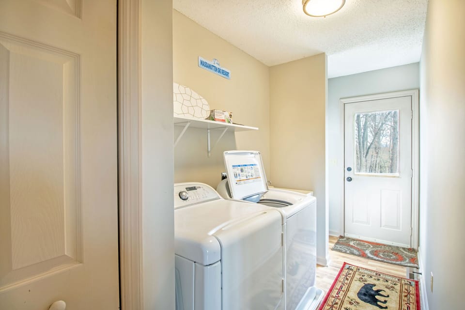 Laundry room with washer and dryer located off of the kitchen