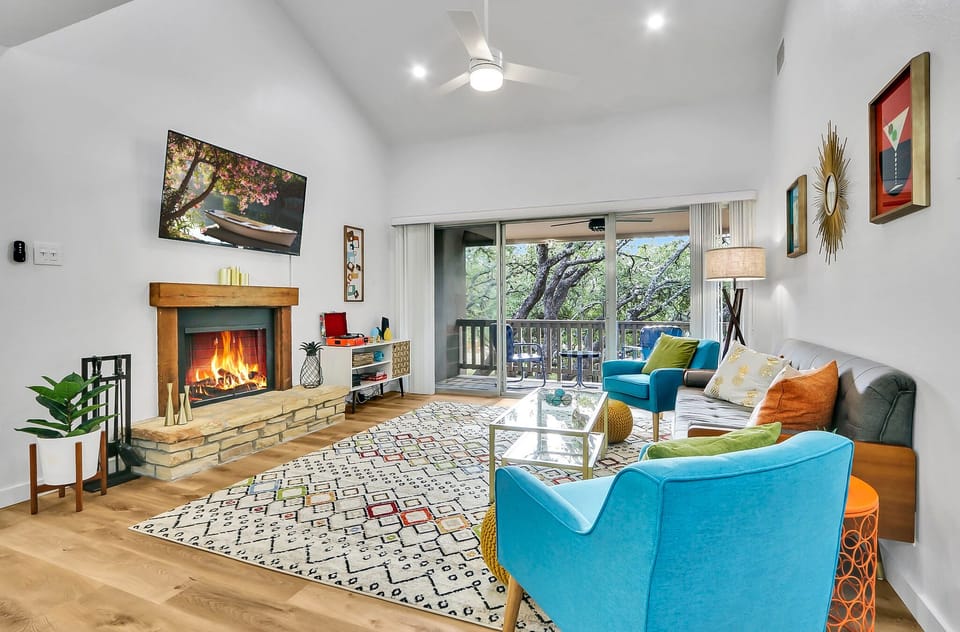 Living room with fire place and flat screen television.