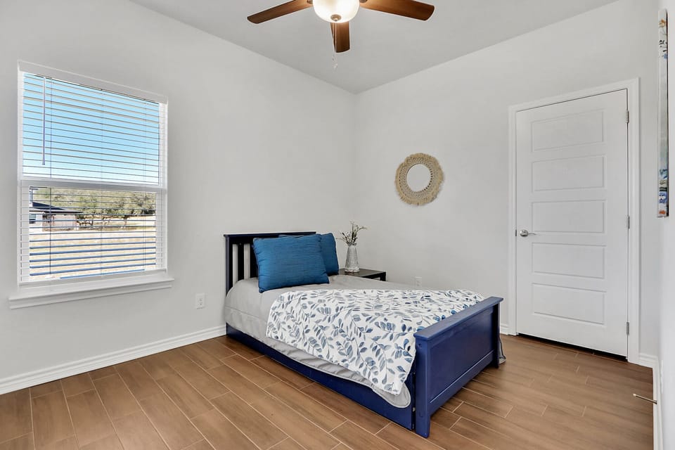 Third bedroom with a trundle bed