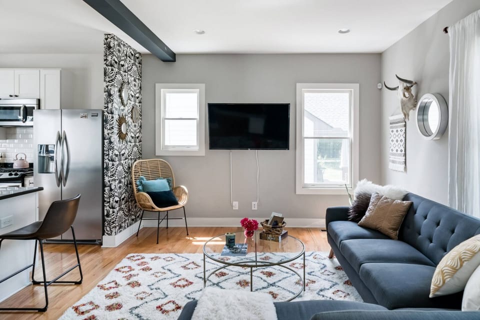 Cozy living room that opens up into the kitchen.
