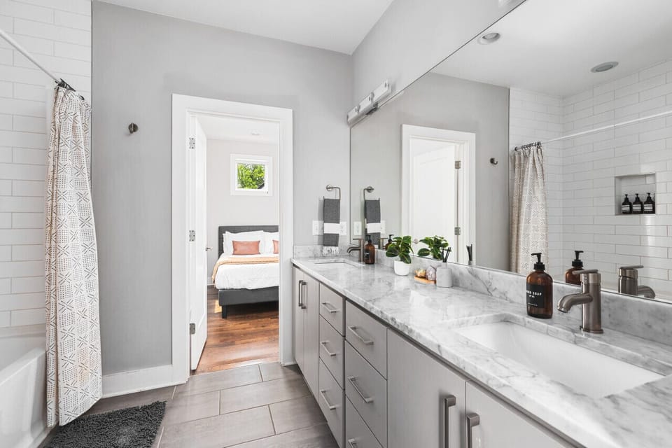Jack and jill bathroom with a shower / tub combo connecting bedrooms #2 and 3.