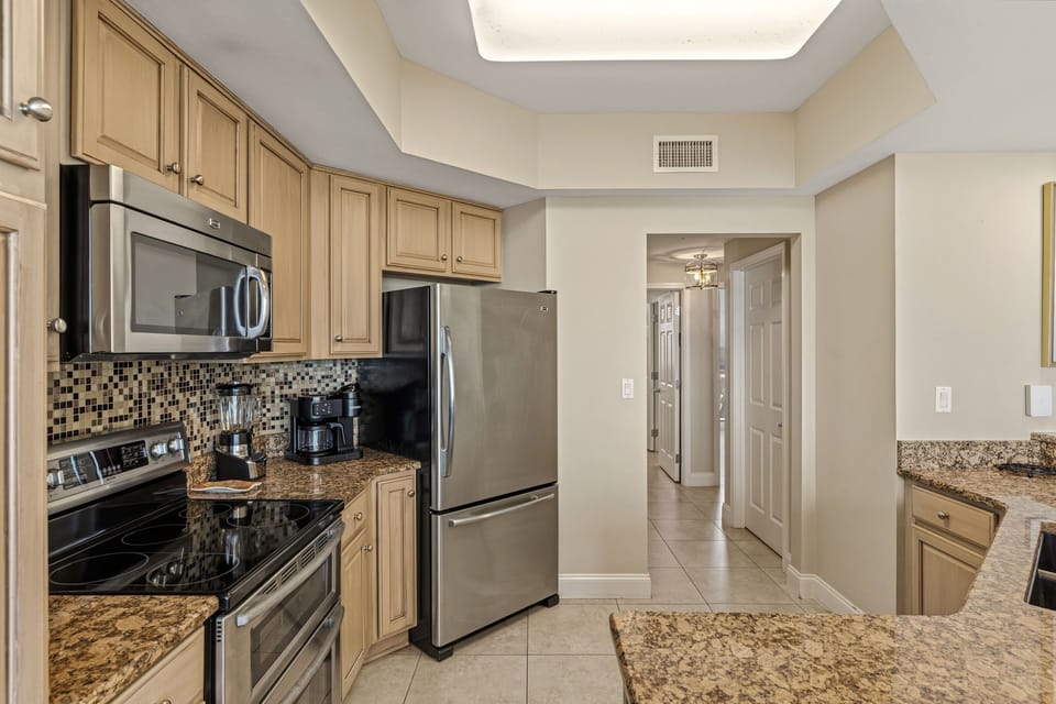 Your fully-equipped kitchen features granite countertops, stainless steel appliances, and everything you need to prepare delicious meals during your stay.