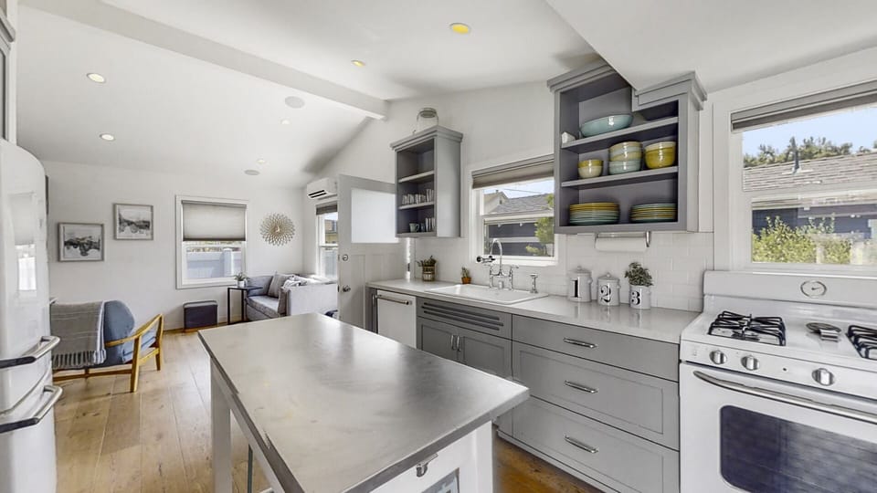 Full kitchen with view into living area