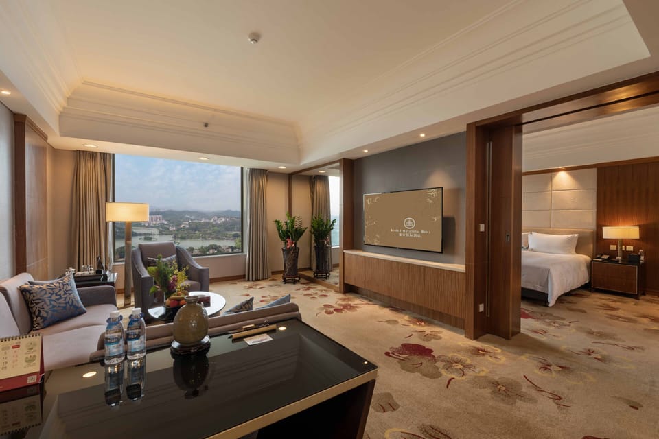 Executive Suite, 1 King Bed, Lake View | Living room | 50-inch LCD TV with satellite channels, TV, pay movies