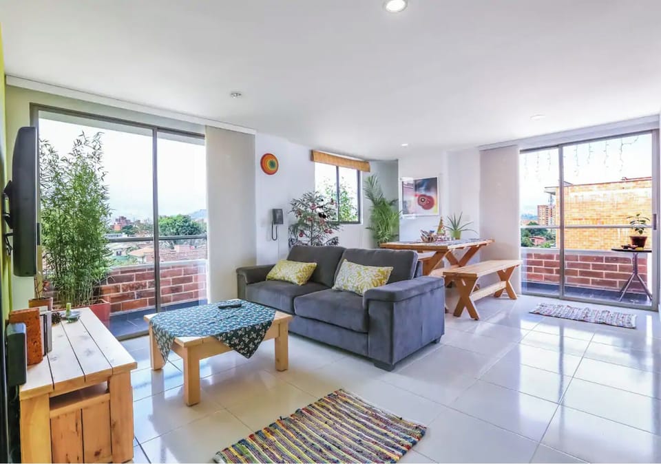 This living room now has a larger L-shaped sofa.