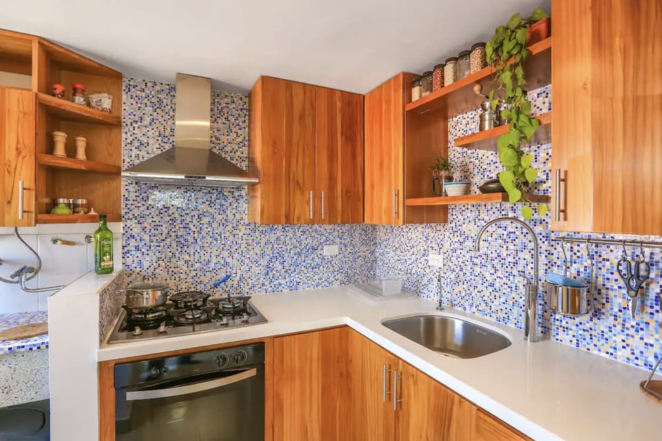 Custom teak cabinets- the gas oven is not connected, but the stove works well.