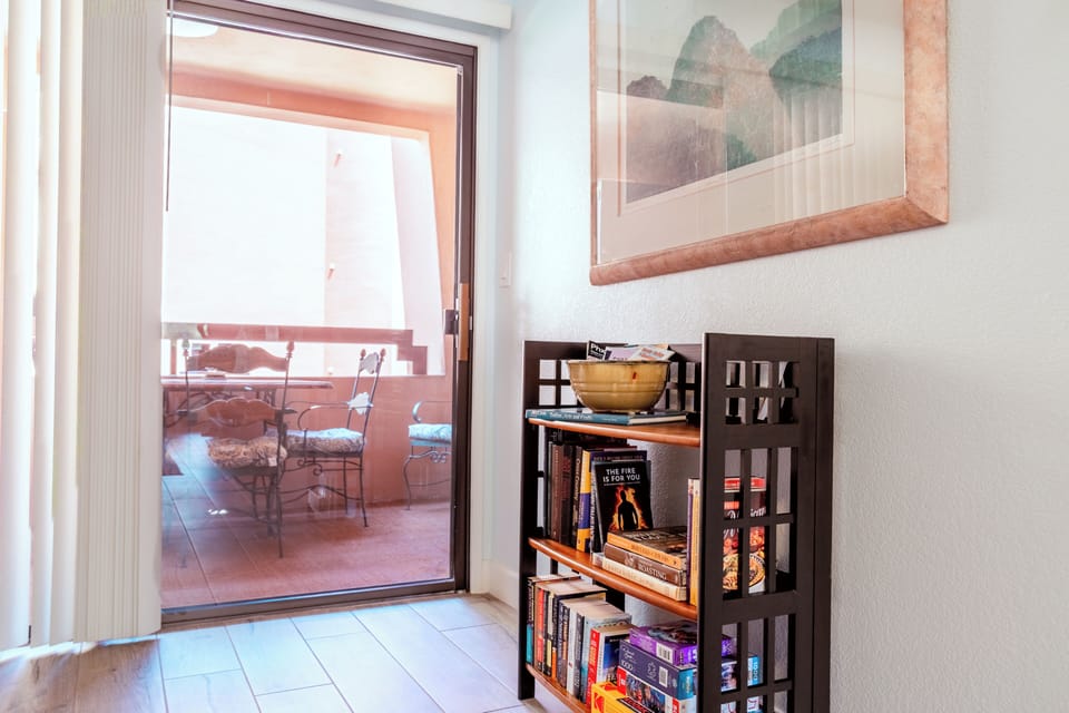Local guides and a few books. Entrance to private balcony.