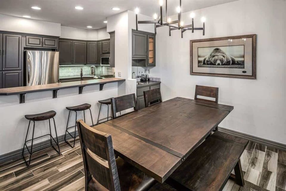 Dining area with additional kitchen bar seating.