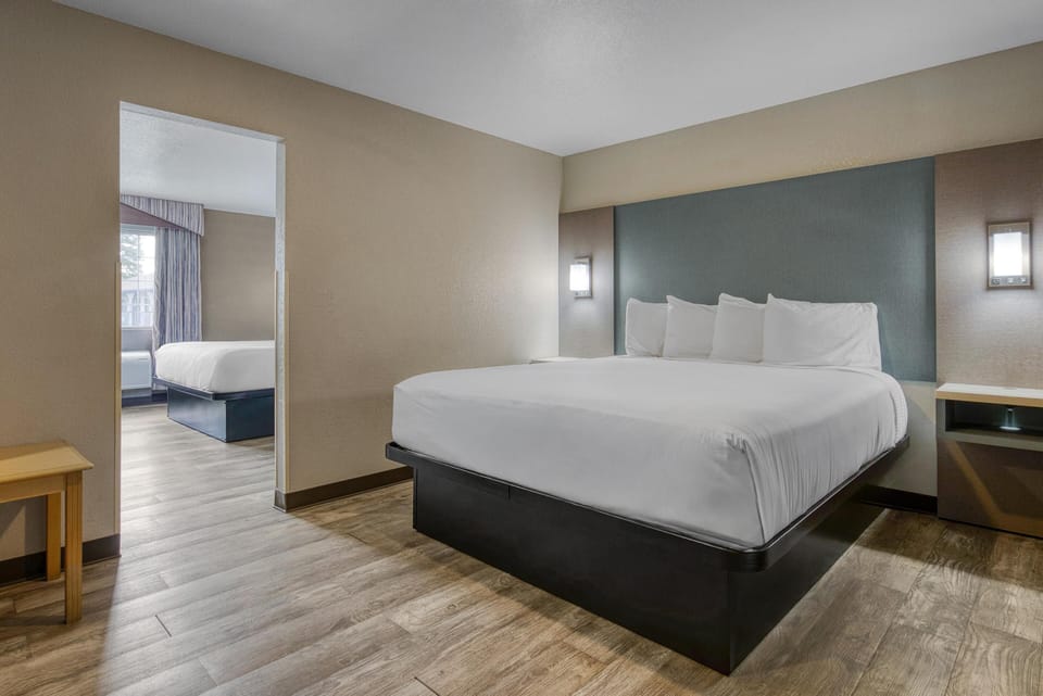 Suite, Multiple Beds, Non Smoking, Jetted Tub | Individually furnished, desk, laptop workspace, iron/ironing board