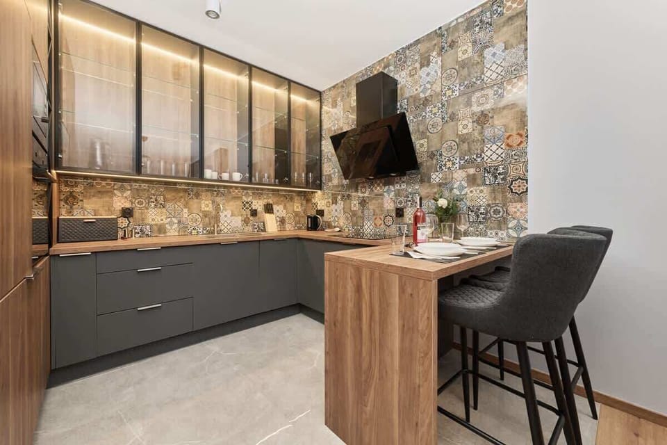 A view of the stylishly decorated kitchenette present in the living room.