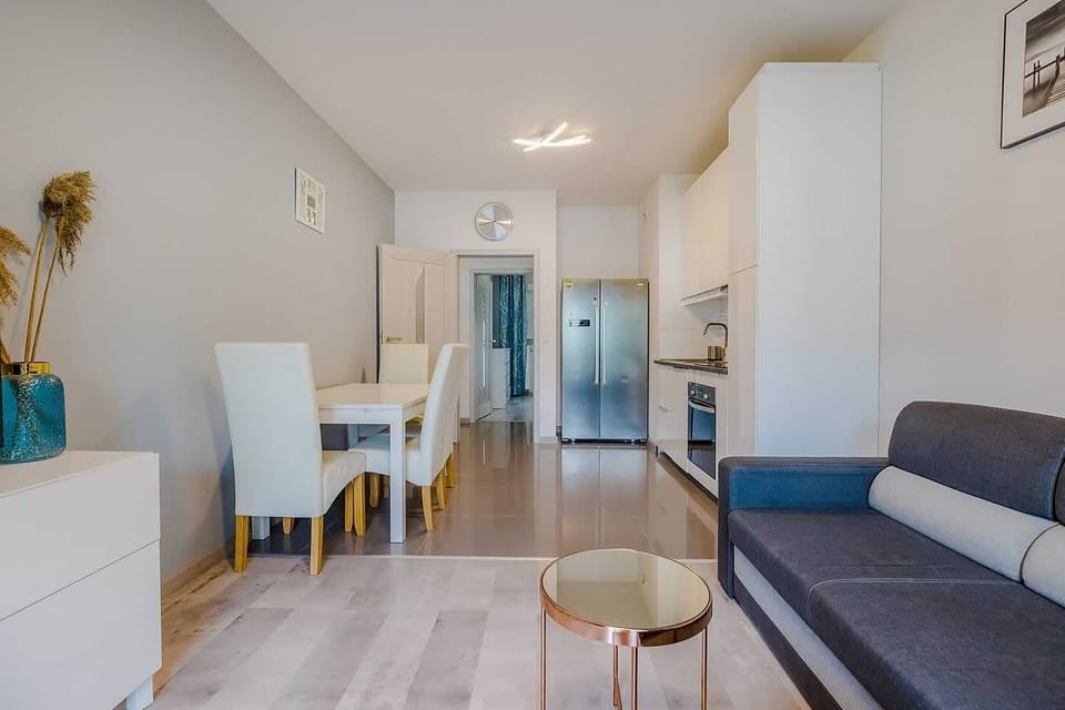 An elegant dining space with a table and chairs, ideal for shared meals or gatherings.