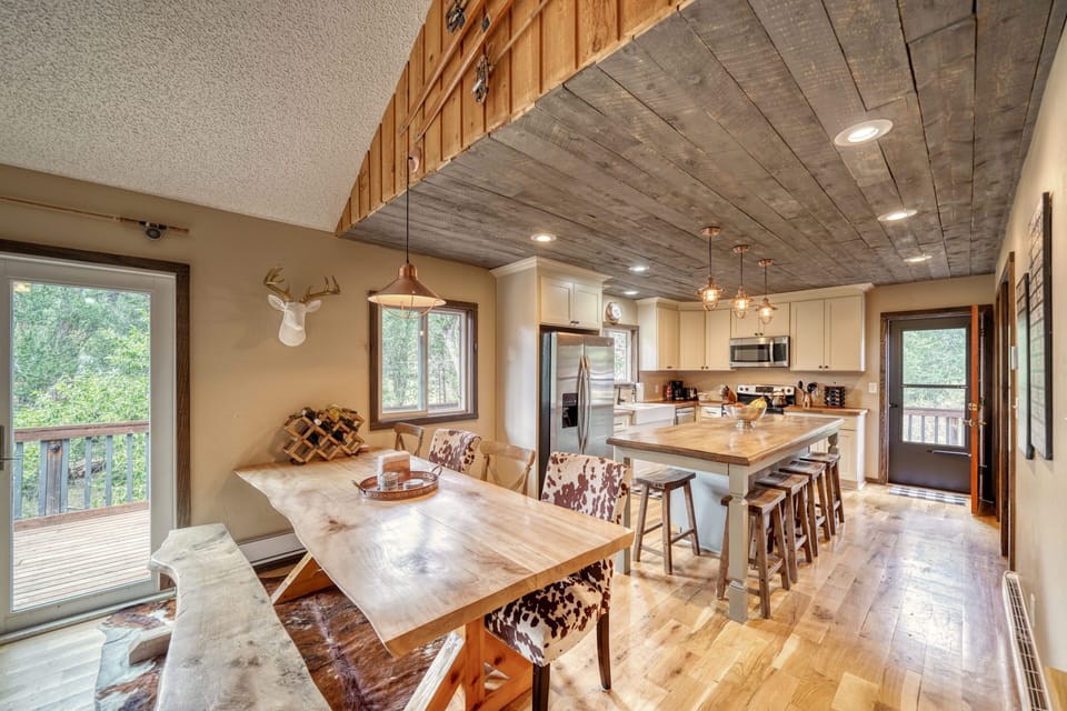 Open-concept dining room, living room, and kitchen.
