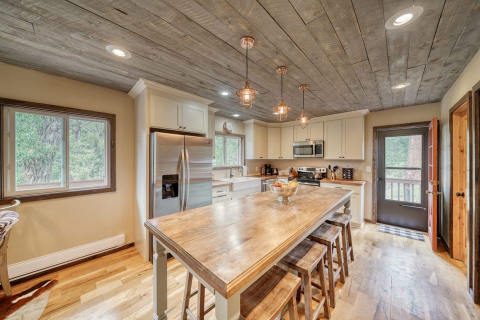Fully-appointed kitchen with bar seating.