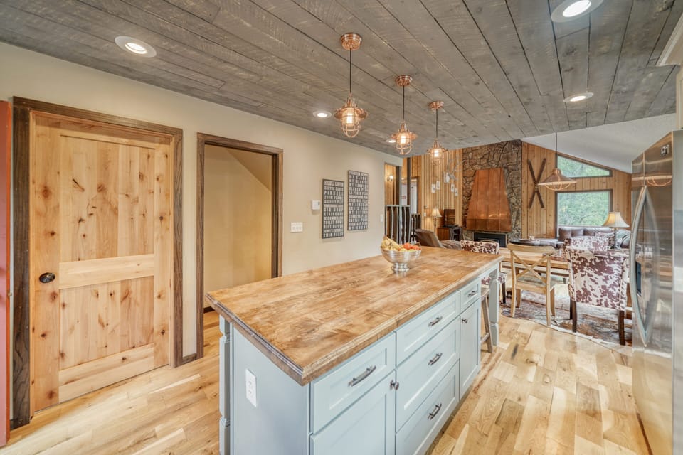 Fully-appointed kitchen with bar seating.