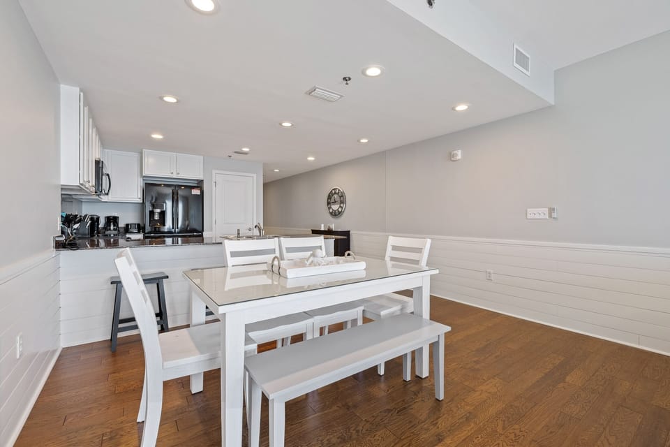 Dining table features 4 chairs, a bench and a glasstop for easy cleanup.
