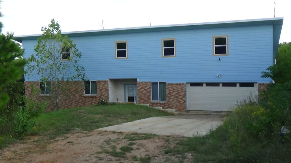 Front of house. The house is not visible from the road. 